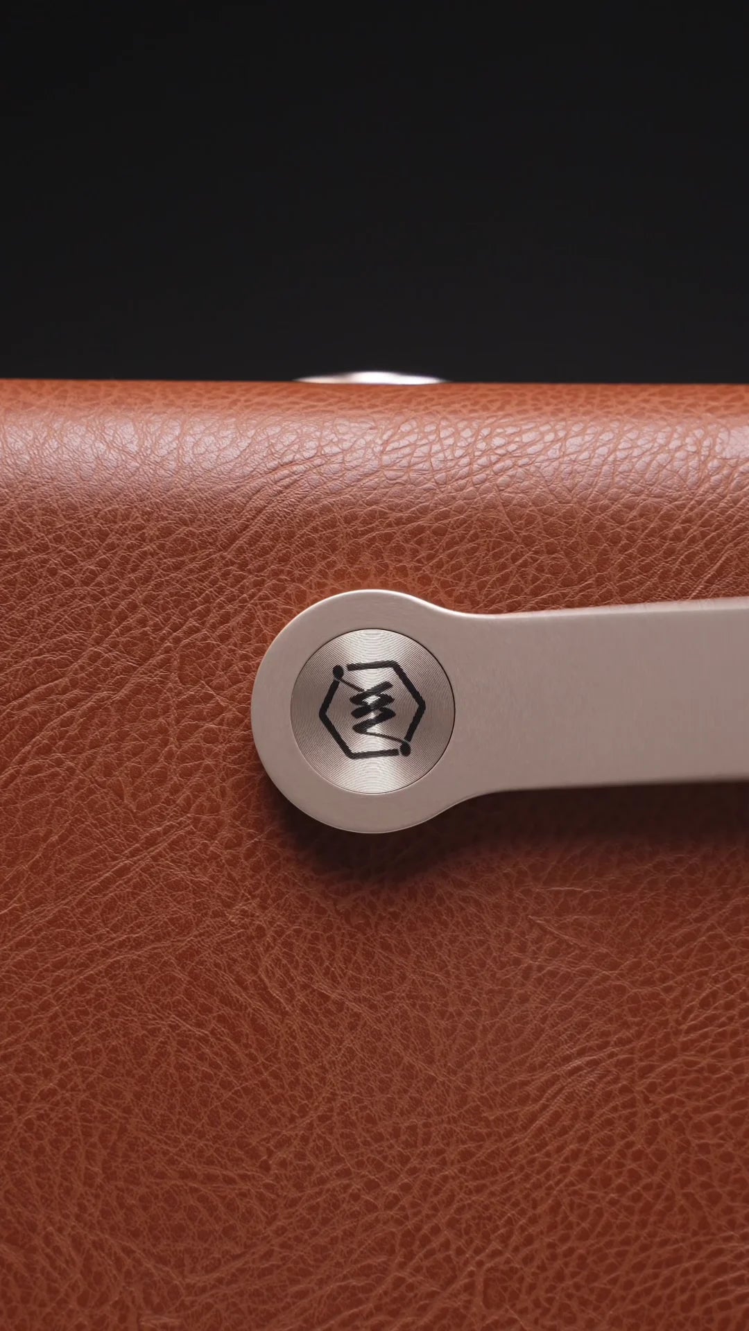 A close view of the W99 carry handle attachment and textured cabinet finish